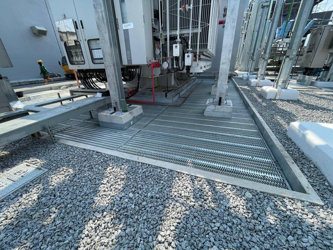 Grating walkway around a substation transformer